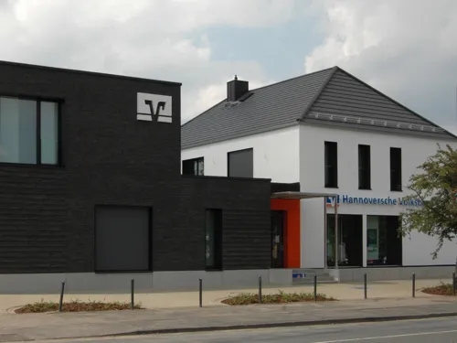 A modern office building on a street.