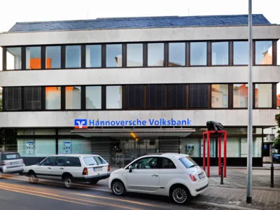 A modern office building on a street.
