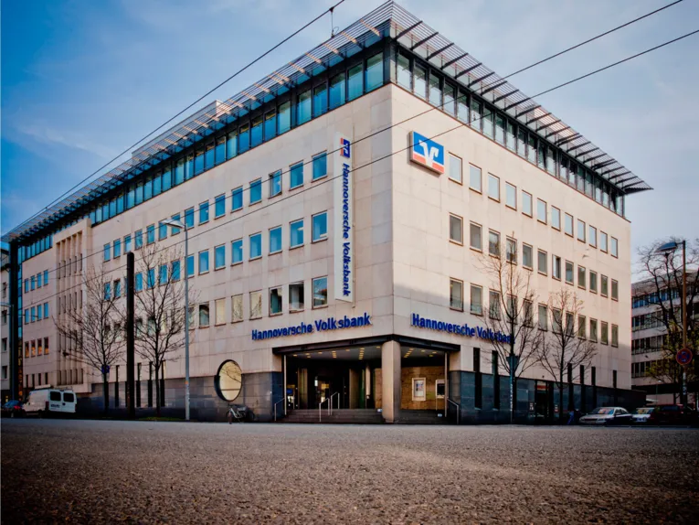 A modern office building on a street.