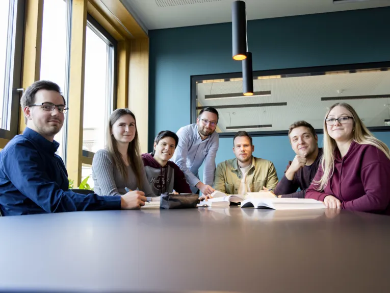 Trainees at a large table.