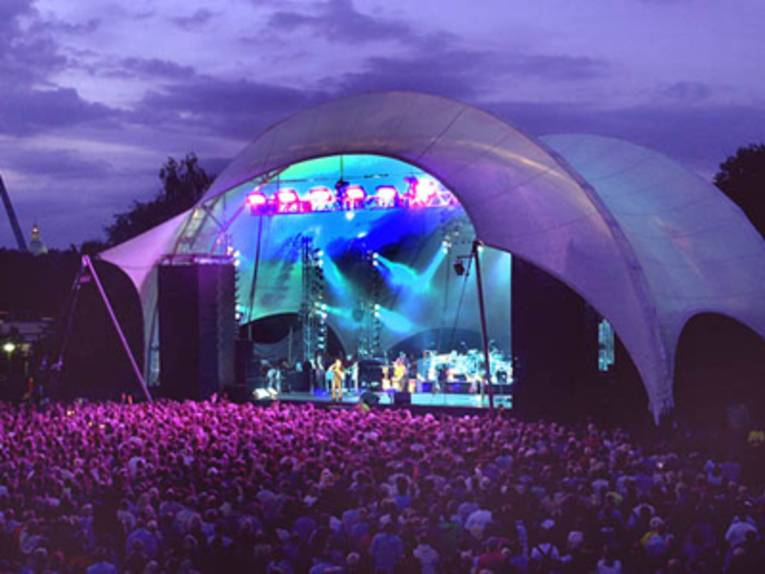 An open-air stage lit up at night.